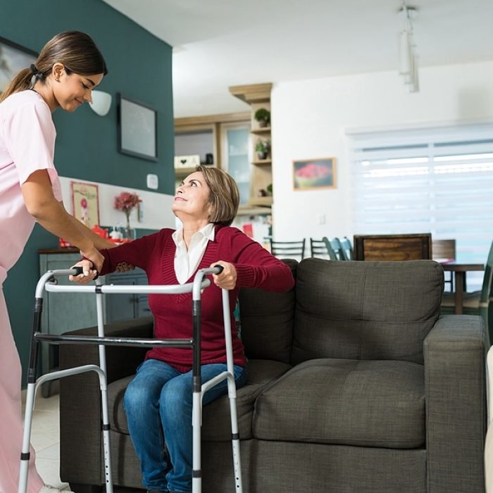 bigstock-Confident-Nurse-Helping-Senior-348268555